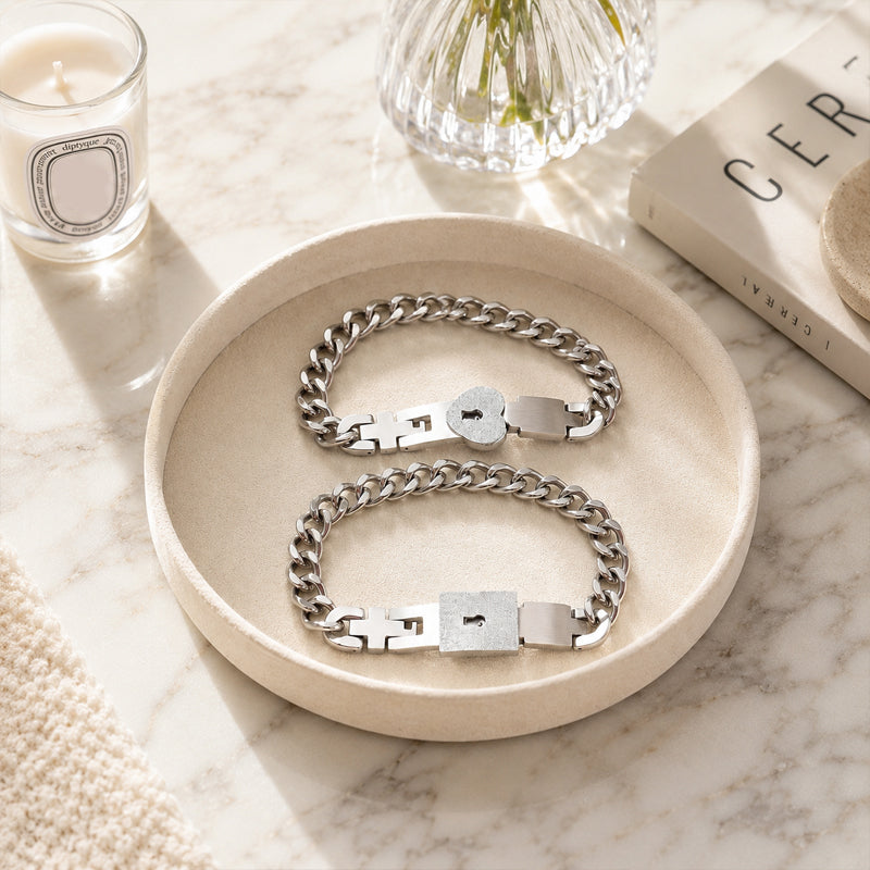Matching bracelets with a heart-shaped padlock