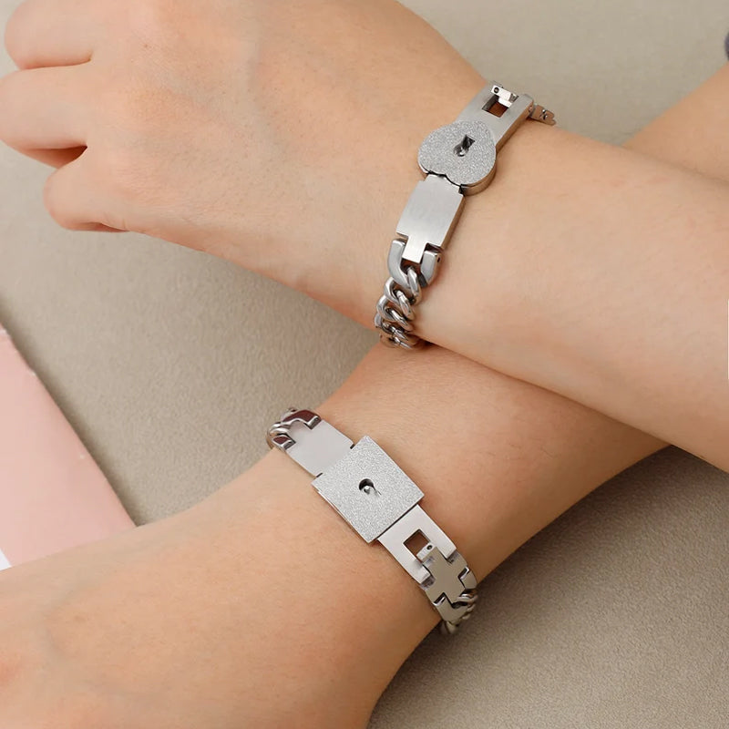 Matching bracelets with a heart-shaped padlock