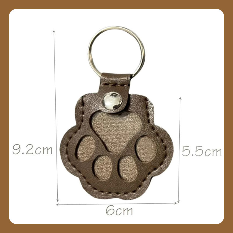 🔥🐾 Ajaton matkamuisto - tassukuvioinen nahkainen avaimenperä